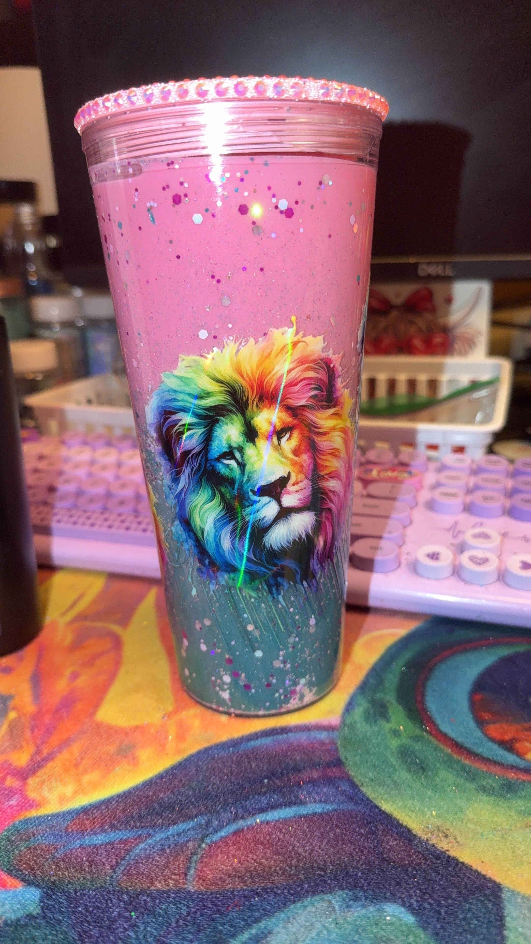 24 oz acrylic dual lava with glitter. Holographic lion wrap with pink bling lid